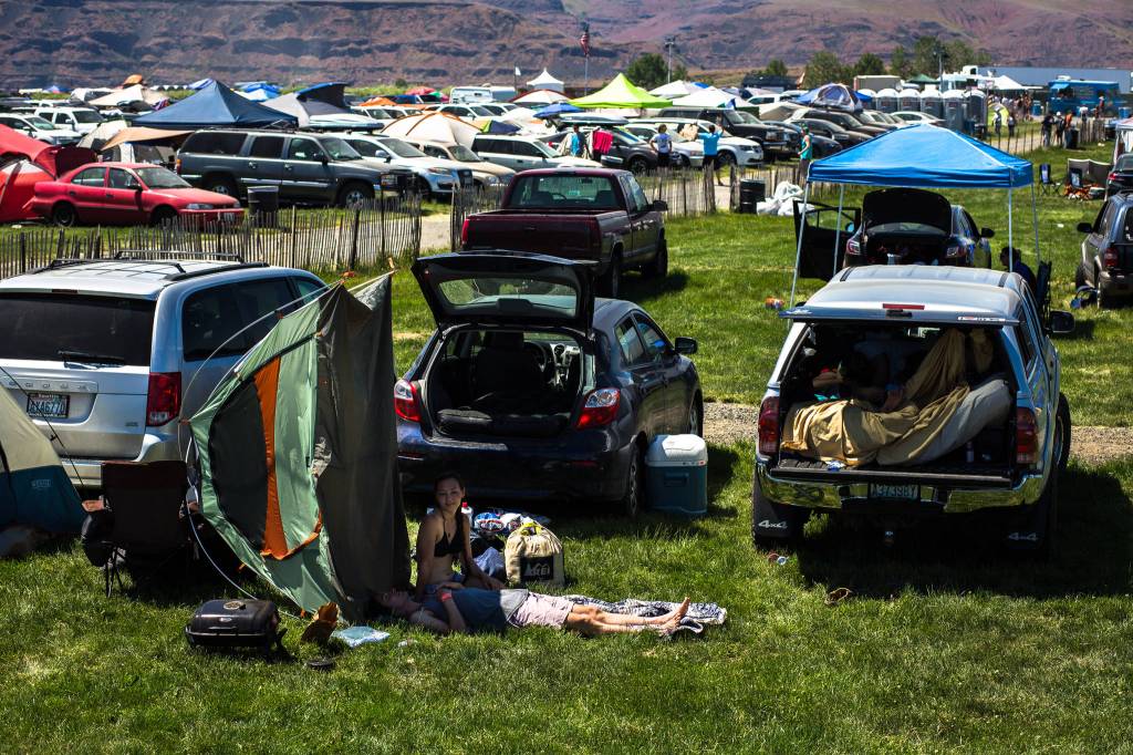 Festival-goers relax before heading into the festival grounds during day three of the annual Sasquatch! Music Festival on Sunday, May 28, 2017 in George, Wa. (Daniella Beccaria / For the Herald )