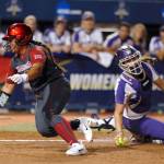 Oklahoma&rsquo;s Fale Aviu avoids the tag of Washington&rsquo;s Morganne Flores on a squeeze bunt in the second inning of the Huskies&rsquo; 3-1 loss to the Sooners at the Women&rsquo;s College World Series Friday in Oklahoma City. (Sarah Phipps/The Oklahoman via AP)