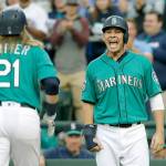 Seattle&rsquo;s Danny Valencia (right) congratulates Taylor Motter on his first-inning grand slam in the Mariners&rsquo; 12-4 win over Tampa Bay Friday in Seattle. (AP Photo/Elaine Thompson)