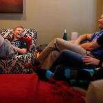 Colton Matter, then 14, laughs with his parents Jeff and Suzy Matter at the family&rsquo;s home in Mill Creek in September, 2014. Colton, now 16, and a varsity golfer for Jackson High School, has fought leukemia since he was 9, and is now in remission. His mother recently said she is concerned what might happen if the Affordable Care Act is repealed. (Ian Terry / Herald file photo)