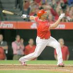 Los Angeles Angels&rsquo; Albert Pujols (right) follows through on his 600th career home run, a grand slam in the fourth innings of the Angels&rsquo; game against Minnesota Saturday in Anaheim, Calif. (AP Photo/Mark J. Terrill)