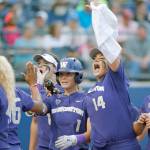 Washington&rsquo;s Ali Aguilar (1) celebrates with Taran Alvelo (14) after hitting a home run in the sixth inning that was the difference in the Huskies&rsquo; 1-0 win over UCLA in a Women&rsquo;s College World Series elimination game Saturday in Oklahoma City. (Bryan Terry/The Oklahoman via AP)