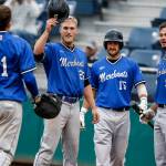 The Merchants&rsquo; Luke Leonard (25), Max Whitt (15), and Austin Atwell (9) congratulate Bryce Brandl (41) on his three-run home run in the third inning during the Everett Cup exhibition game against the Aquasox on June 13, 2017, at Everett Memorial. (Ian Terry / The Herald)