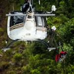 A mock victim is hoisted into a helicopter during Snohomish County Search and Rescue training at the Big Four Ice Caves on June 10. (Ian Terry / The Herald)