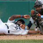 Aquasox&rsquo;s Greifer Andrade is tagged out at home plate by Hillsboro Hops catcher Cole Thompson in Everett&rsquo;s 9-2 loss to the Hops at Everett Memorial Stadium on June 19. (Andy Bronson / The Herald)