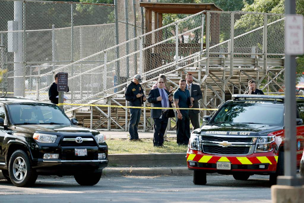 Law enforcement officers investigate the scene of a shooting near a baseball field in Alexandria, Virginia, on Wednesday. House Majority Whip Steve Scalise of Louisiana was among those shot at a baseball practice. (AP Photo/Alex Brandon)
