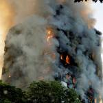 Smoke and flames rise from a massive apartment fire in west London on Wednesday. (AP Photo/Matt Dunham)