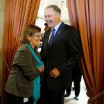 Washington Gov. Jay Inslee (right) greets Rep. June Robinson, D-Everett, in the wings of the House chamber at the Capitol in Olympia after the Legislature approved a new two-year state operating budget. (AP Photo/Ted S. Warren)