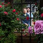Antique Rose Farm owner Jackie McElhose and her son, farm manager Jeff McElhose, stand among some of the many roses grown at their Snohomish-area business. (Andy Bronson / The Herald)