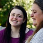 Recent AIM High School graduate Dakota Mowry, 18, talks with her mom, Crystal Scholl, at the family home in Snohomish Wednesday. Scholl was pregnant when she started at AIM, and baby Dakota, born in 1999, was cared for at the school&rsquo;s child-care center. Scholl graduated from AIM in 2000. (Dan Bates / The Herald)
