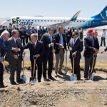 Officials of Alaska Airlines, Propeller Airports and local governments celebrate after a groundbreaking ceremony for the new Paine Field passenger terminal on Monday in Everett. (Andy Bronson / The Herald)