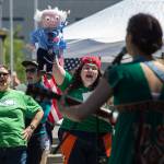 Holding a Bernie Sanders puppet, Leslie Zukor cheers as she and others sing along to the song &ldquo;Take It Personally&rdquo; sung by Tae Phoenix at an event called Stop Trumpcare Day at the Snohomish County Courthouse on Thursday in Everett. The protest was organized by Indivisible, an organization of some 6,000 community groups nationally. (Andy Bronson / The Herald)