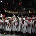 Snohomish High graduates celebrate the end of their graduation ceremony at Xfinity Arena on Monday in Everett. (Andy Bronson / The Herald)