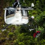 A mock victim is hoisted into a helicopter during Snohomish County Search & Rescue training at the Big Four Ice Caves on Saturday. A spate of rescues on nearby Mount Pilchuck have authorities urging hikers to exercise caution as higher elevation trails can be deceptively difficult to navigate in spring conditions. (Ian Terry / The Herald)