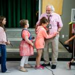 James Monroe Elementary School students say their good-byes to Principal Gerard Holzman during an assembly to celebrate his 17 years of service at the Everett school on Wednesday, June 21. (Ian Terry / The Herald)