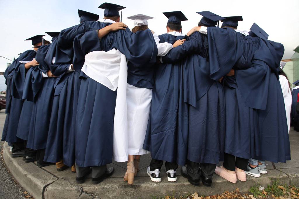 Glacier Peak High School seniors take a photo together before the start of their graduation ceremony at Xfinity Arena on Monday in Everett. (Andy Bronson / The Herald)