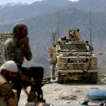 U.S. forces and Afghan security police are seen in Asad Khil near the site of a U.S. bombing in the Achin district of Jalalabad, east of Kabul, Afghanistan, in April. (AP Photo/Rahmat Gul, File)