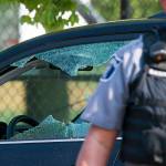 A police officer stands by an automobile with a damaged driver&rsquo;s window at the scene of the shootings in Alexandria, Virginia, on Wednesday, where House Majority Whip Steve Scalise of Louisiana was among those shot. (AP Photo/Cliff Owen)