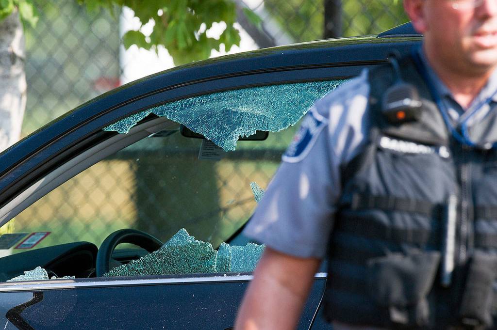 A police officer stands by an automobile with a damaged driver&rsquo;s window at the scene of the shootings in Alexandria, Virginia, on Wednesday, where House Majority Whip Steve Scalise of Louisiana was among those shot. (AP Photo/Cliff Owen)