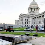 The new Ten Commandments monument outside the state Capitol in Little Rock, Arkansas, is blocked off Wednesday morning after someone crashed into it with a vehicle, less than 24 hours after the privately funded monument was erected. (AP Photo/Jill Zeman Bleed)