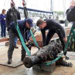 Divers prepare the cannon for transportation at Dodson Boat Yard in Stonington, Connecticut, on May 24. The cannon is believed to be from the wreck of U.S.S. Revenge in 1811. (U.S. Navy)