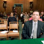 In this 2007 photo, then-former Deputy Attorney General James Comey waits to testify on Capitol Hill in Washington before the Senate Judiciary Committee hearing regarding the fired prosecutors. (AP Photo/Susan Walsh, File)