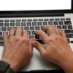 A person works on a laptop in North Andover, Massachusetts, on June 19. (AP Photo/Elise Amendola)