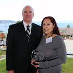 Community Transit CEO Emmett Heath presents the 2016 Curb the Congestion Champion of the Year award to Jessica Bentem of Everett. (Contributed photo)
