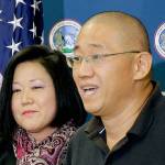 Kenneth Bae (right), who had been detained in North Korea since 2012, talks to reporters after arriving at Joint Base Lewis-McChord near Tacoma after he was freed in 2014. At left is his sister, Terri Chung. (AP Photo/Ted S. Warren)