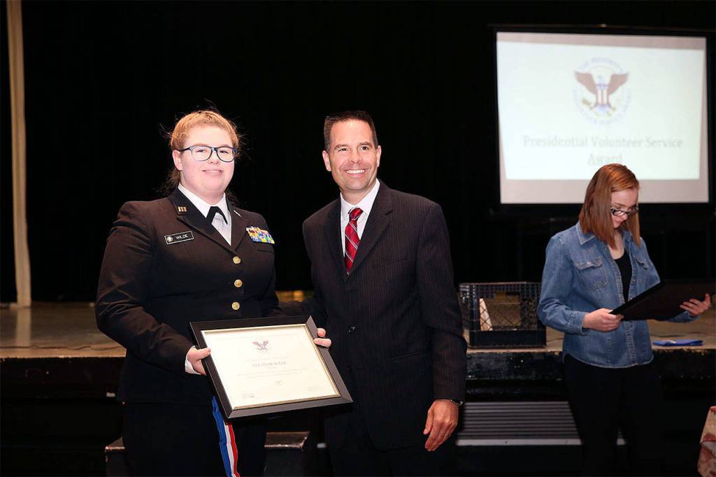 Navy Junior ROTC Cadet Eleanor Wilde earns a Presidential Volunteer medal for 294 hours of community service in one year, presented by Marysville Mayor Jon Nehring. (Contributed photo)