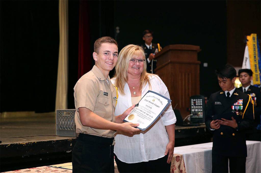 Navy Junior ROTC Cadet Ian Crosby is awarded Cadet of the Year by Donetta Oremus, the Marysville School District&rsquo;s CTE director. (Contributed photo)