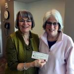Mary Lou Finley accepts a check from Jody LaBissoniere for the Providence General Children&rsquo;s Association, one of two recent contributions from local Guild groups. (Contributed photo)