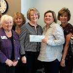 Twig Shop managers Kathy Duffy and Linda Jubie are joined by gift shop volunteers presenting a check to Providence General Children&rsquo;s Association. (Contributed photo)
