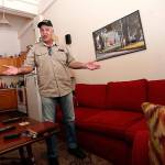 Michael Esnault discusses his plight inside his apartment at the American Can Apartments in New Orleans in March. (AP Photo/Gerald Herbert)