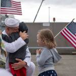A sailor embraces his family before going underway aboard the Arleigh Burke-class guided missile destroyer USS Shoup (DDG 86) on June 1, 2017. Shoup is part of the Nimitz Carrier Strike Group and is departing on a scheduled deployment to the Western Pacific. (U.S. Navy photo by Mass Communication Specialist 2nd Class Alex Van&rsquo;tLeven)