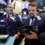 Specialists work on the floor of the New York Stock Exchange on Thursday. (AP Photo/Richard Drew)