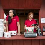 Hannah Waring (left), a student at Loudoun Valley High School, and Abby McDonough, a student at Liberty University, work in a strawberry stand at Wegmeyer Farms in Hamilton, Virginia, in May. Summer jobs are vanishing as U.S. teens spend more time in school and face competition from older workers. (AP Photo/Carolyn Kaster)