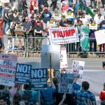 Demonstrators against Islamic law (background) gather in New York on Saturday, June 10, as counter demonstrators line up across Centre St., foreground. (AP Photo/Craig Ruttle)