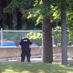 An Evergreen State College police officers keeps watch over campus as student evacuate following a &ldquo;direct threat&rdquo; on Thursday, June 1. (Tony Overman /The Olympian via AP)