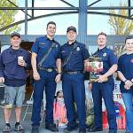 The Lake Stevens Fire Department raised $6,917.70 for the MDA Fill The Boot campaign. Pictured from left are MDA regional representative Emily Stewart, firefighters Pat Cook and Brian Kees, IAFF Local 3235 president Capt. Mike Eagle, firefighter David Pick, and probationary firefighter Nadia Kukhotskaya. (Contributed photo by Adam Blue)