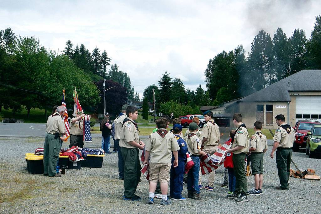 American Legion Post 181 in cooperation with Boy Scouts of America&rsquo;s Mount Baker Council Troop 42 gathered June 10 to properly retire more than 315 U.S. flags. (Contributed photo)