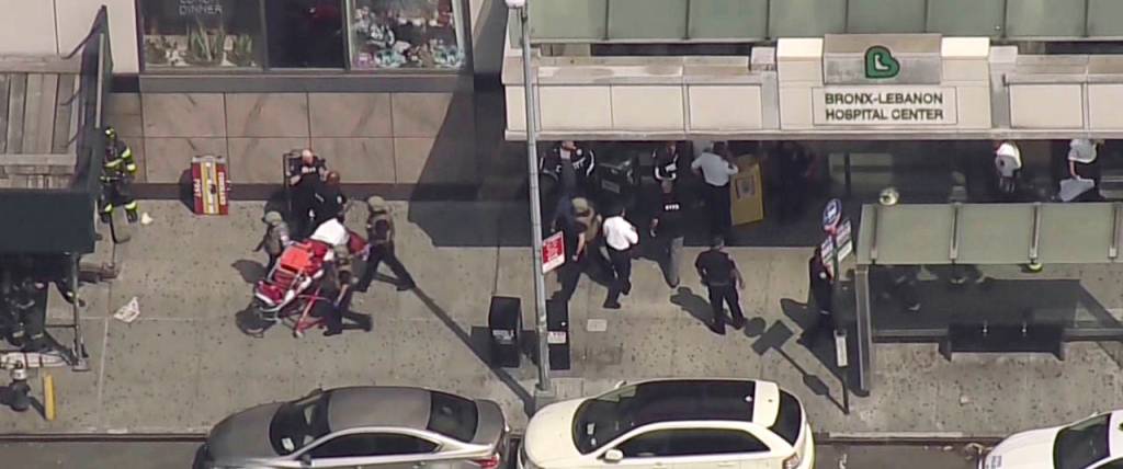 In this image taken from video, emergency personnel converge on Bronx Lebanon Hospital in New York after a gunman opened fire there on Friday. (NBC 4 New York via AP)