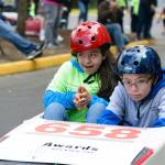 The Rotary Club of Lynnwood held its Challenge Soap Box Derby races on June 4. Co-driver Salome Gonzolez-Angel races down the track with driver Max Rooney. (Photo by Anna Marie Jensen)