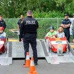 Go-cart racers Kiersten Shankle (from left), Tyler Shankle, William Lewis and Harrison Youngman get ready to race at the Challenge Soap Box Derby races on June 4. (Photo by Anna Marie Jensen)