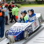 Burke Nelson (left) and Max Rooney get ready to race at the Challenge Soap Box Derby races on June 4. (Photo by Anna Marie Jensen)