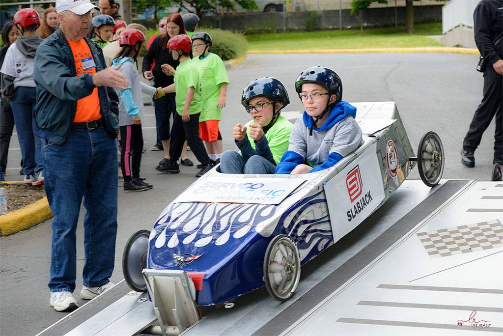 Burke Nelson (left) and Max Rooney get ready to race at the Challenge Soap Box Derby races on June 4. (Photo by Anna Marie Jensen)