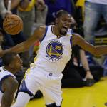 Warriors forward Kevin Durant (35) reacts after dunking against the Cavaliers next to forward Andre Iguodala during the first half of Game 1 of the NBA Finals on June 1, 2017, in Oakland, Calif. (AP Photo/Ben Margot)