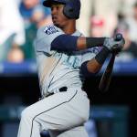 The Mariners&rsquo; Jean Segura follows the flight of his single during a game against the Rockies on May 30, 2017, in Denver. (AP Photo/David Zalubowski)