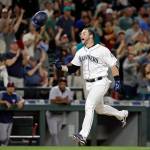 The Mariners&rsquo; Mike Zunino tosses his batting helmet as he heads home on his walk-off two-run home run during a game against the Twins on June 7, 2017, in Seattle. (AP Photo/Elaine Thompson)