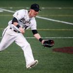 Lynnwood shortstop Kyler McMahan fields a ground ball on the run during a game against Snohomish on March 28, 2017, at Mountlake Terrace High School. (Ian Terry / The Herald)